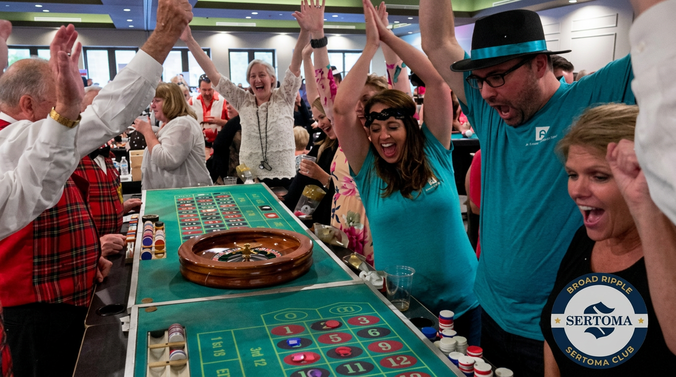 Guests cheering around the roulette wheel at a Sertoma casino night