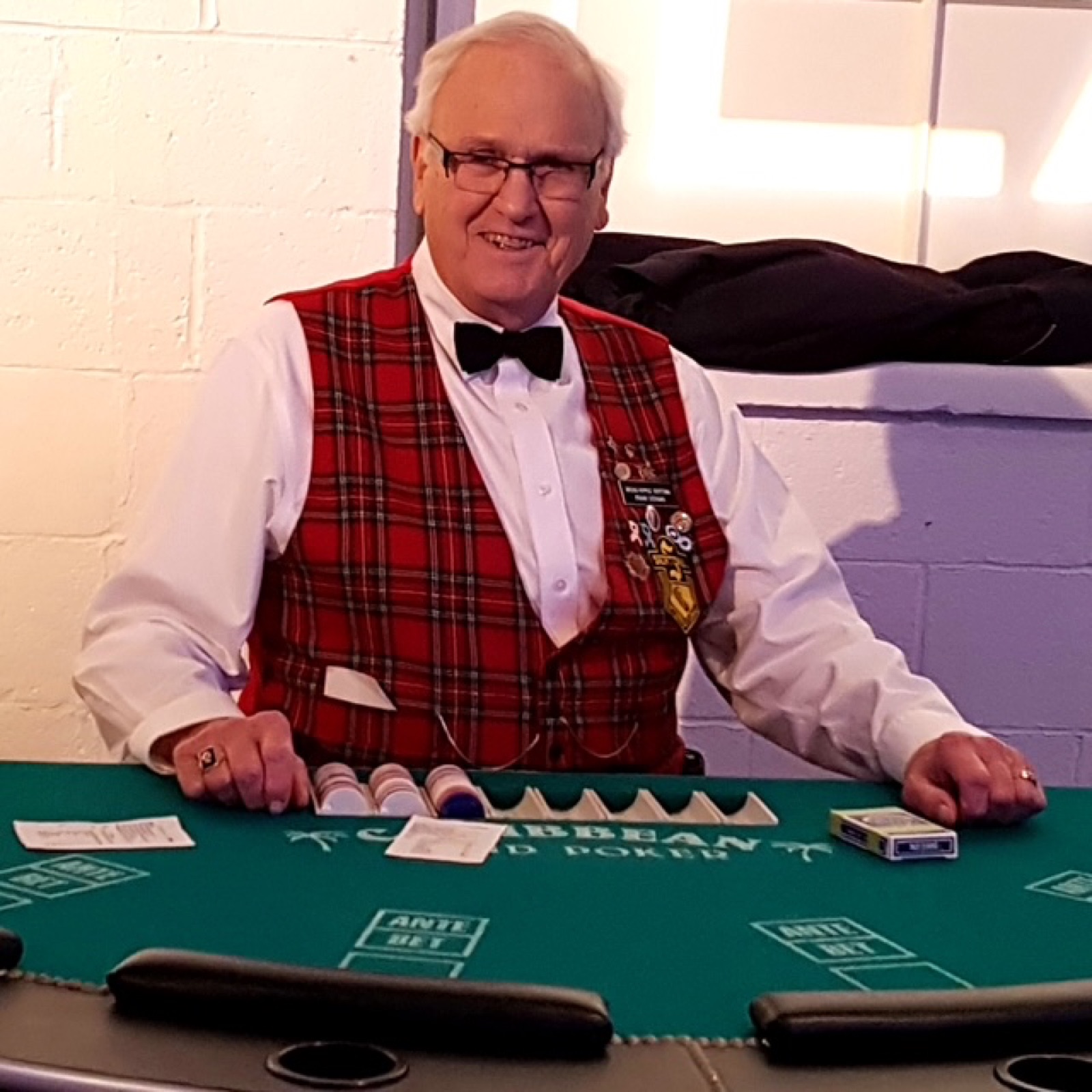 Sertoma volunteer dealer smiling at a blackjack table during a charity casino party in Indianapolis
